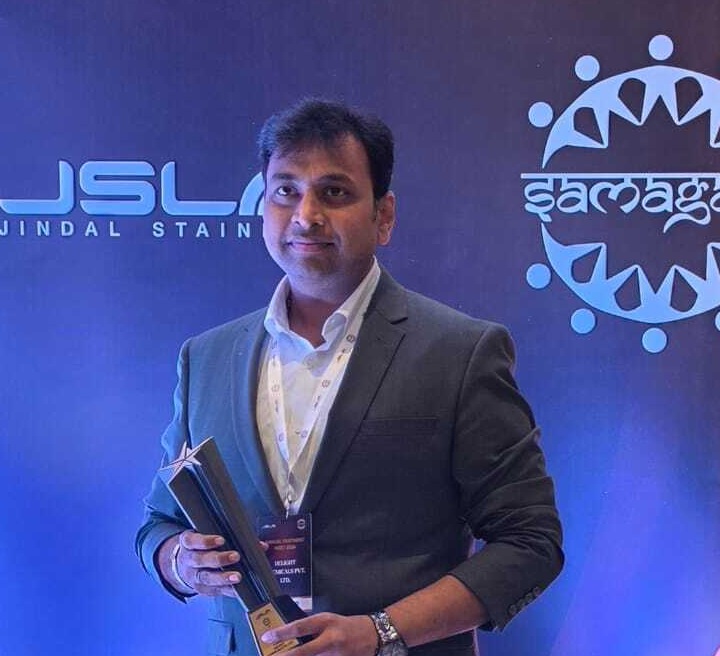 Professional holding award at JSL Jindal Stainless corporate event